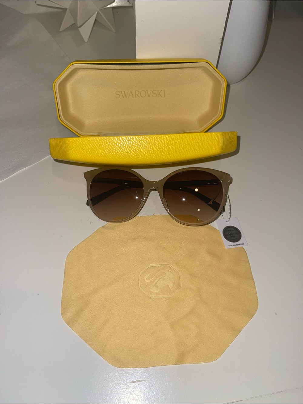 Swarovski Womenโs Cat Eye Sunglasses - Beige Plastic Frame Brown Gradient Lens